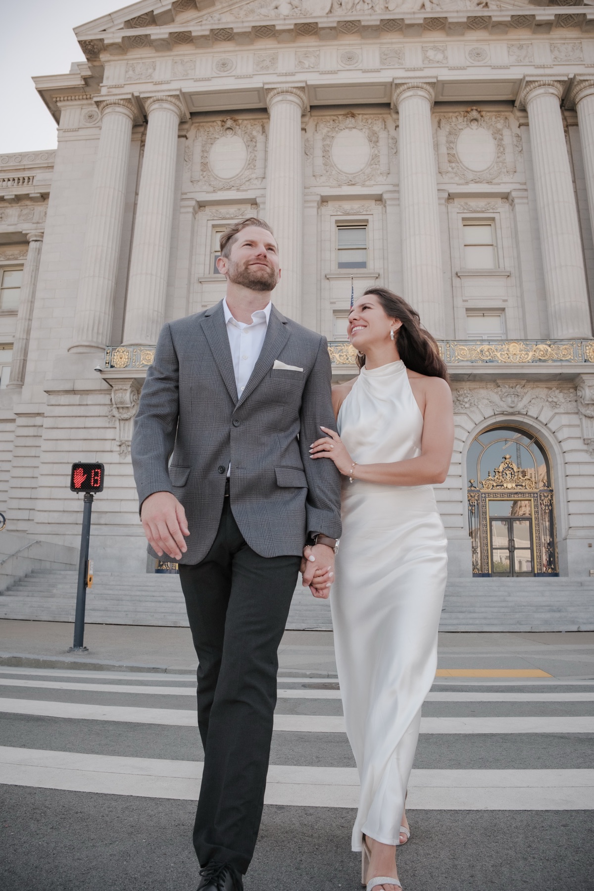 Golden hour candid portrait of a couple after their San Francisco City Hall wedding ceremony