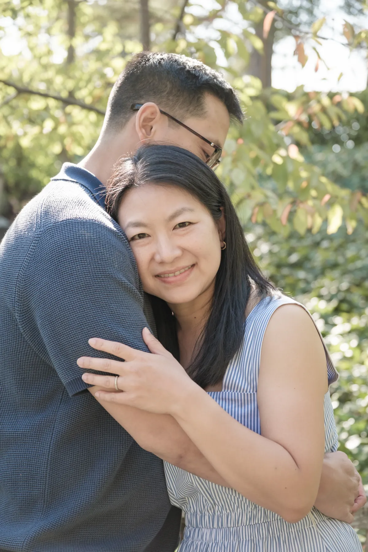 Mom and Dad embracing under the trees at Piedmont Park, Piedmont CA