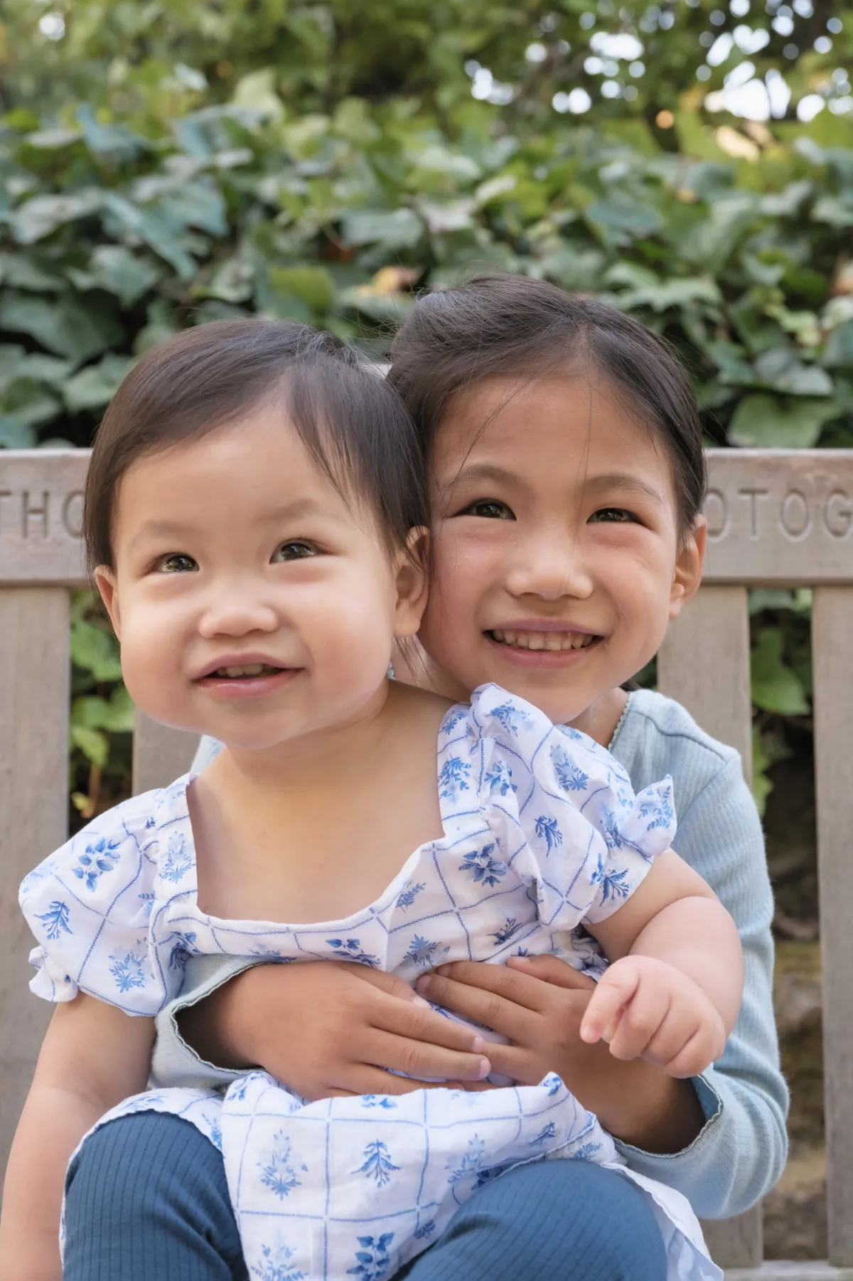 Two sisters on a bench at Piedmont Park, Piedmont CA