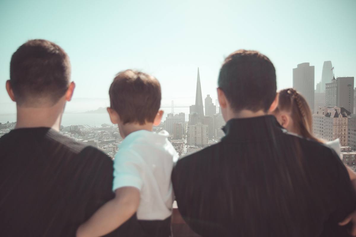 Close view of the family from behind as they take in the San Francisco skyline