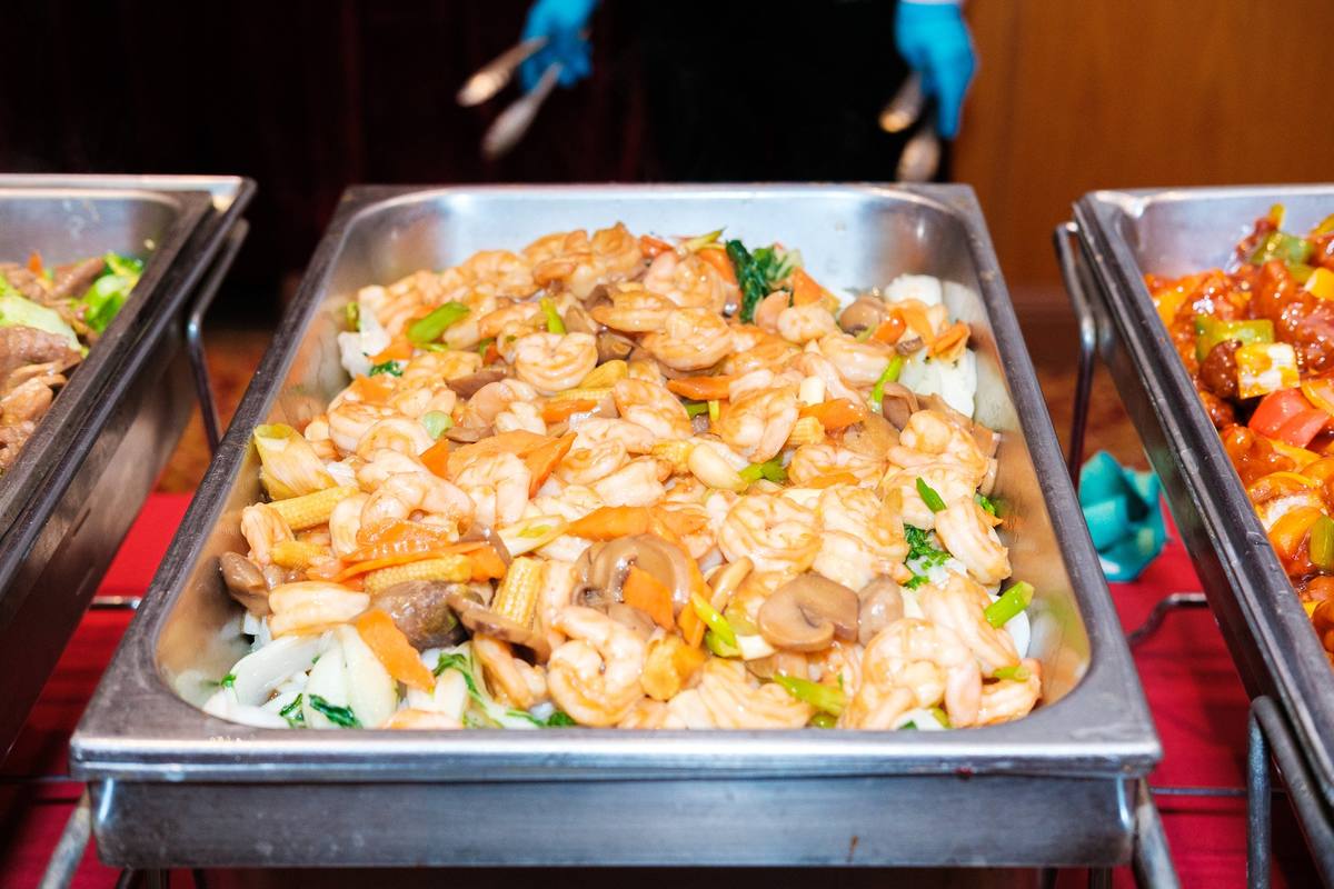 Buffet tray of stir-fried shrimp with vegetables