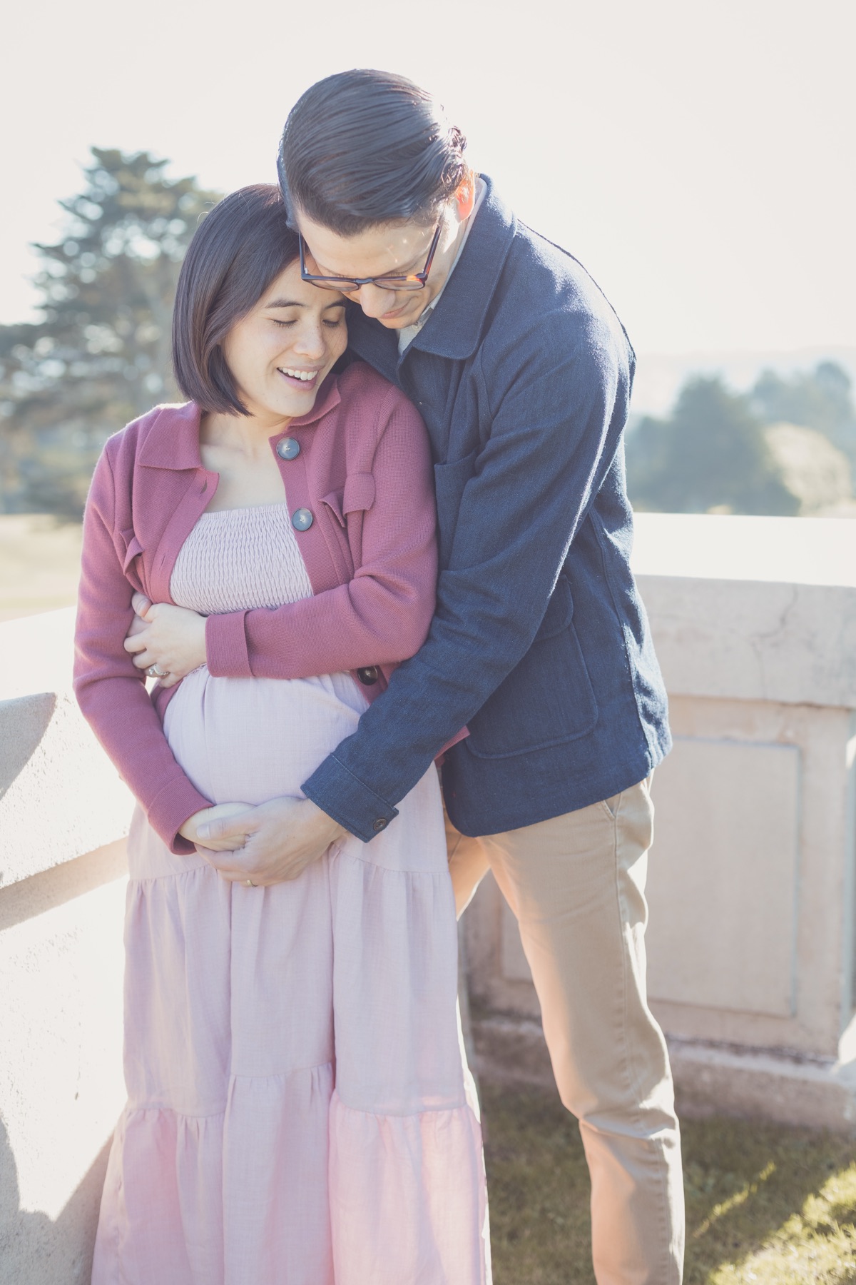 Expecting couple embracing during a maternity session