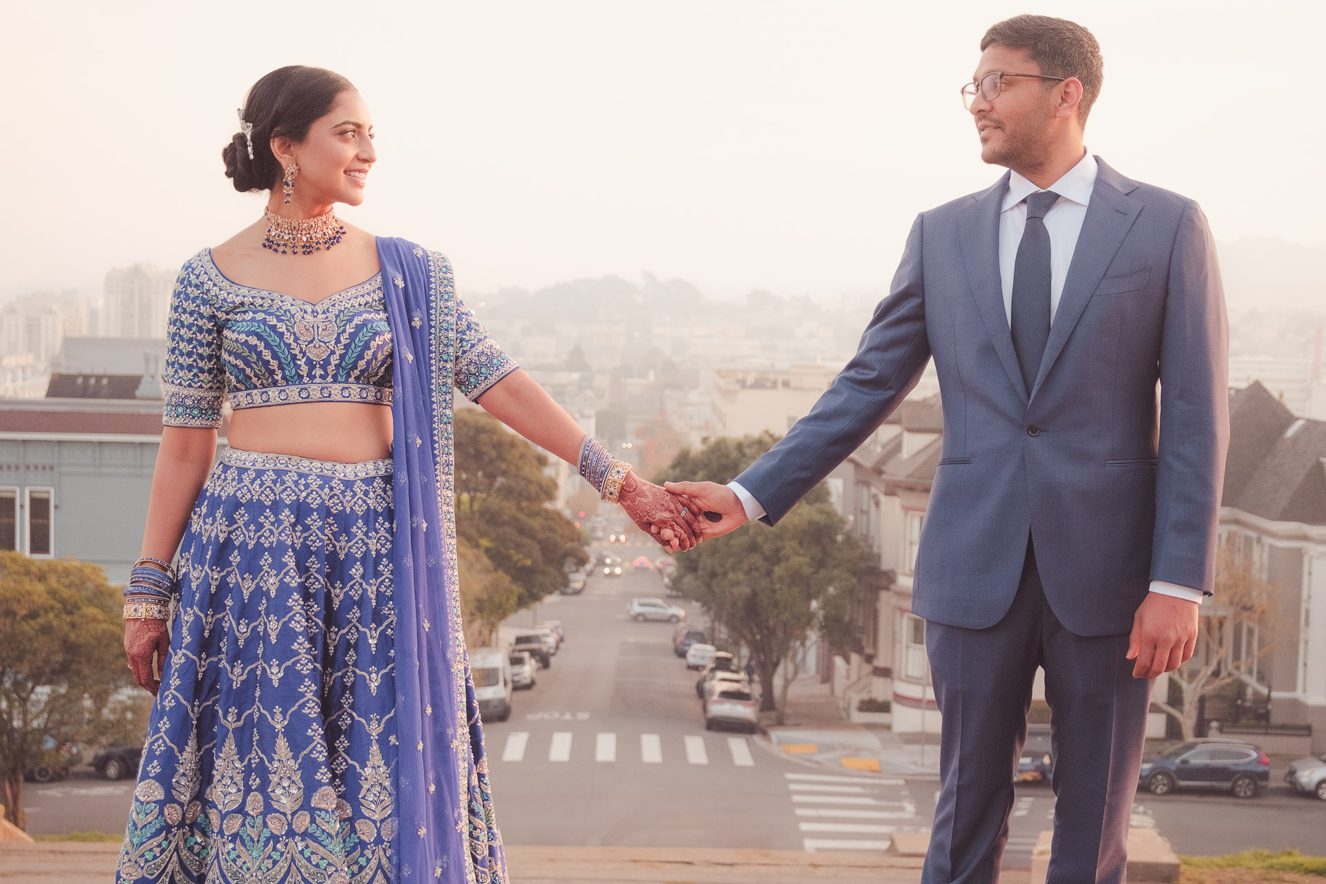 Couple running together on a San Francisco beach — engagement photography by Matt Dea