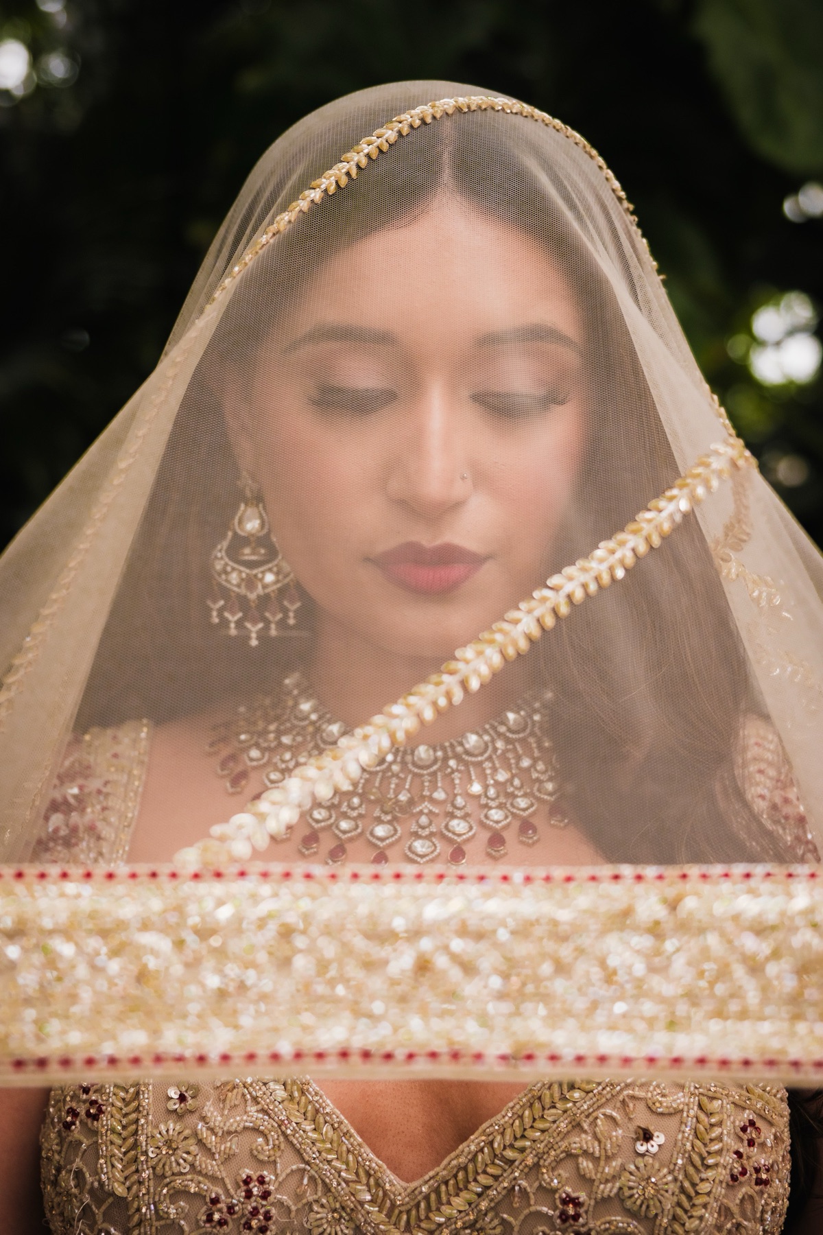 Indian bride in a veil and gold bridal jewelry, San Francisco wedding photography by Matt Dea