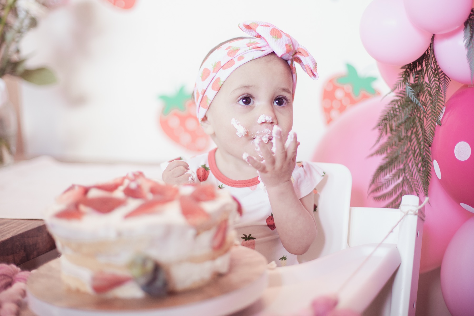 The Baum Family’s daughter at her first birthday cake smash — photography by Matt Dea
