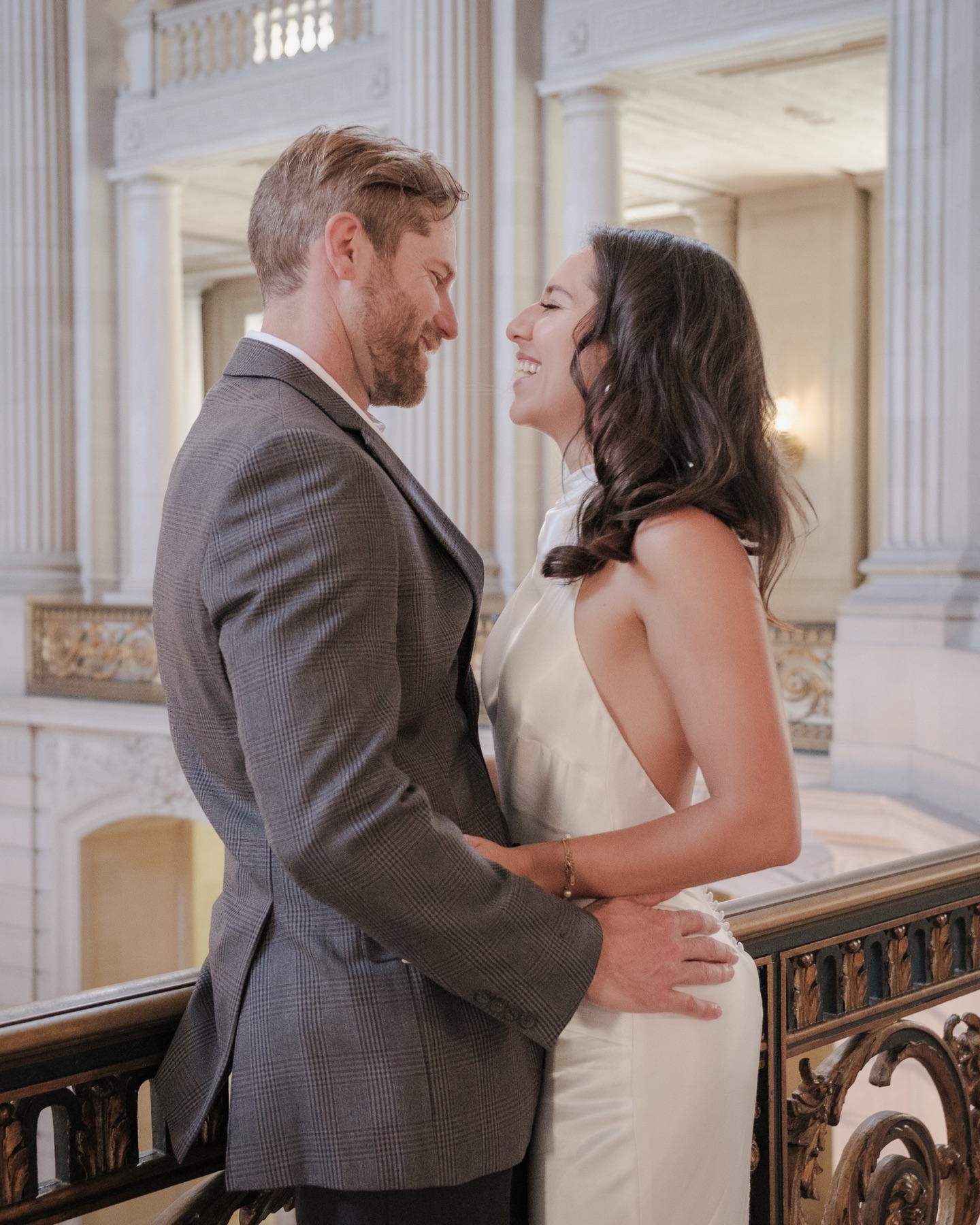 Couple during their intimate San Francisco City Hall wedding on the grand staircase — City Hall wedding photography by Matt Dea