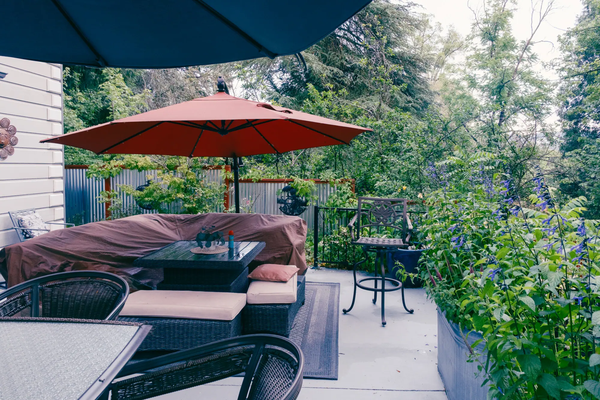 The inn's patio with a red umbrella