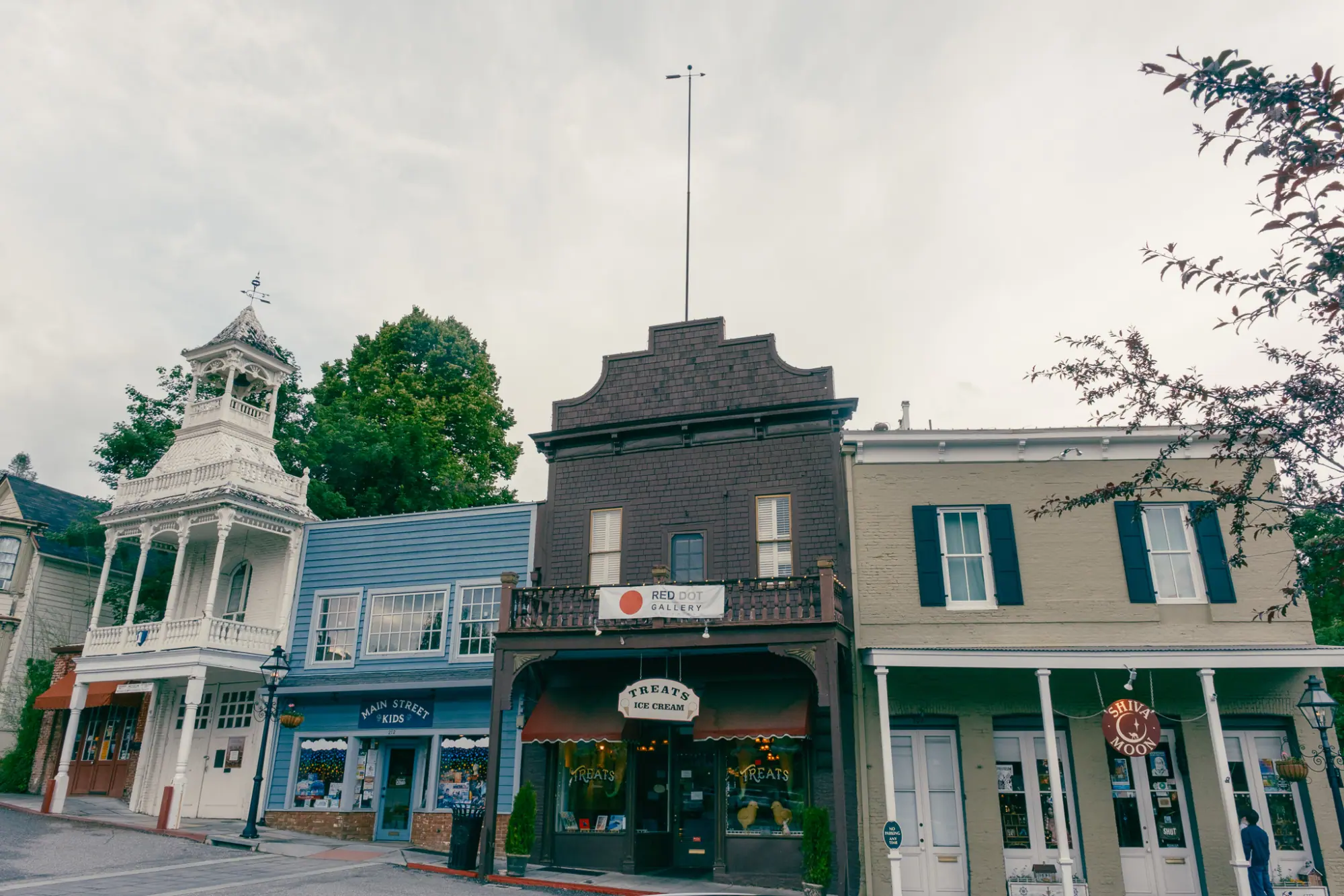 A row of historic storefronts and a cupola