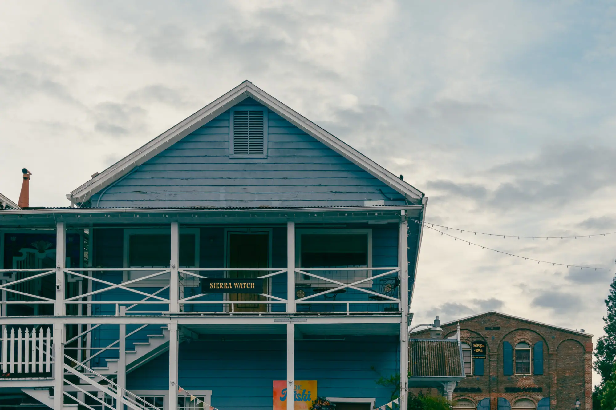 A wooden building with wraparound balconies