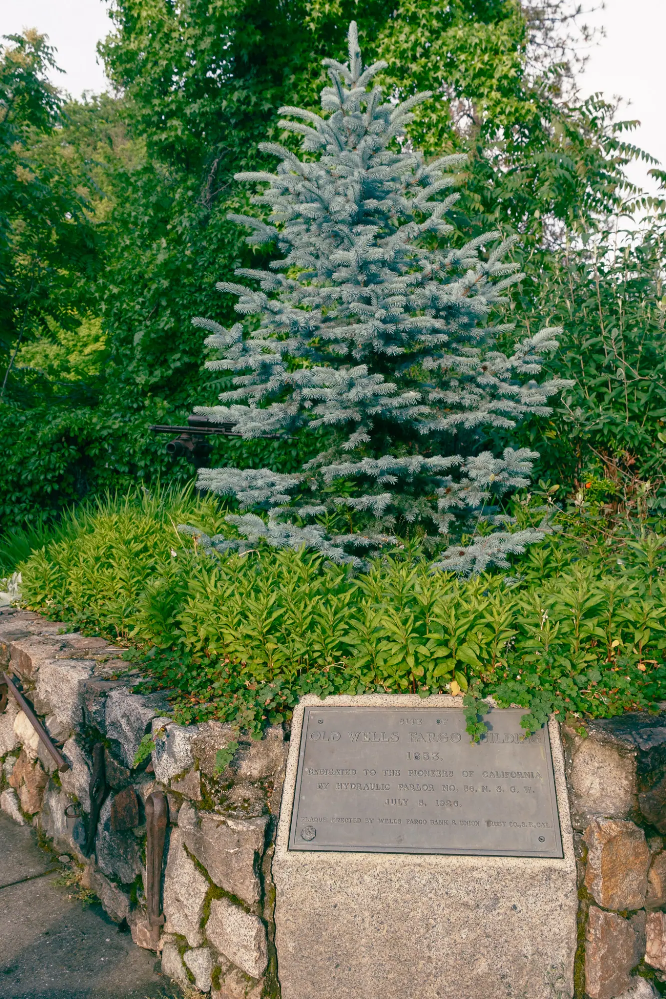 A plaque marking the site of the old Wells Fargo building
