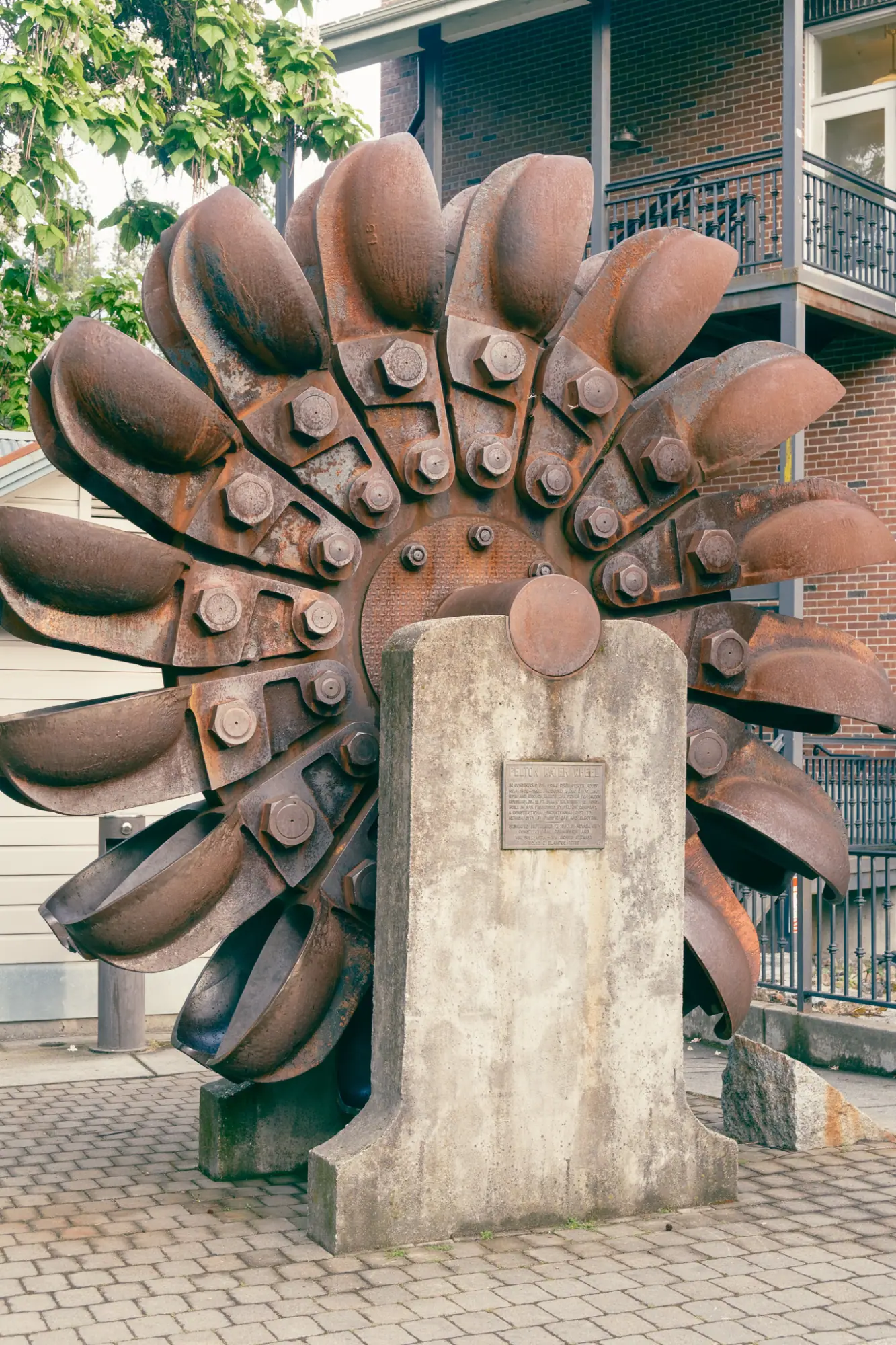 A Pelton wheel on display downtown