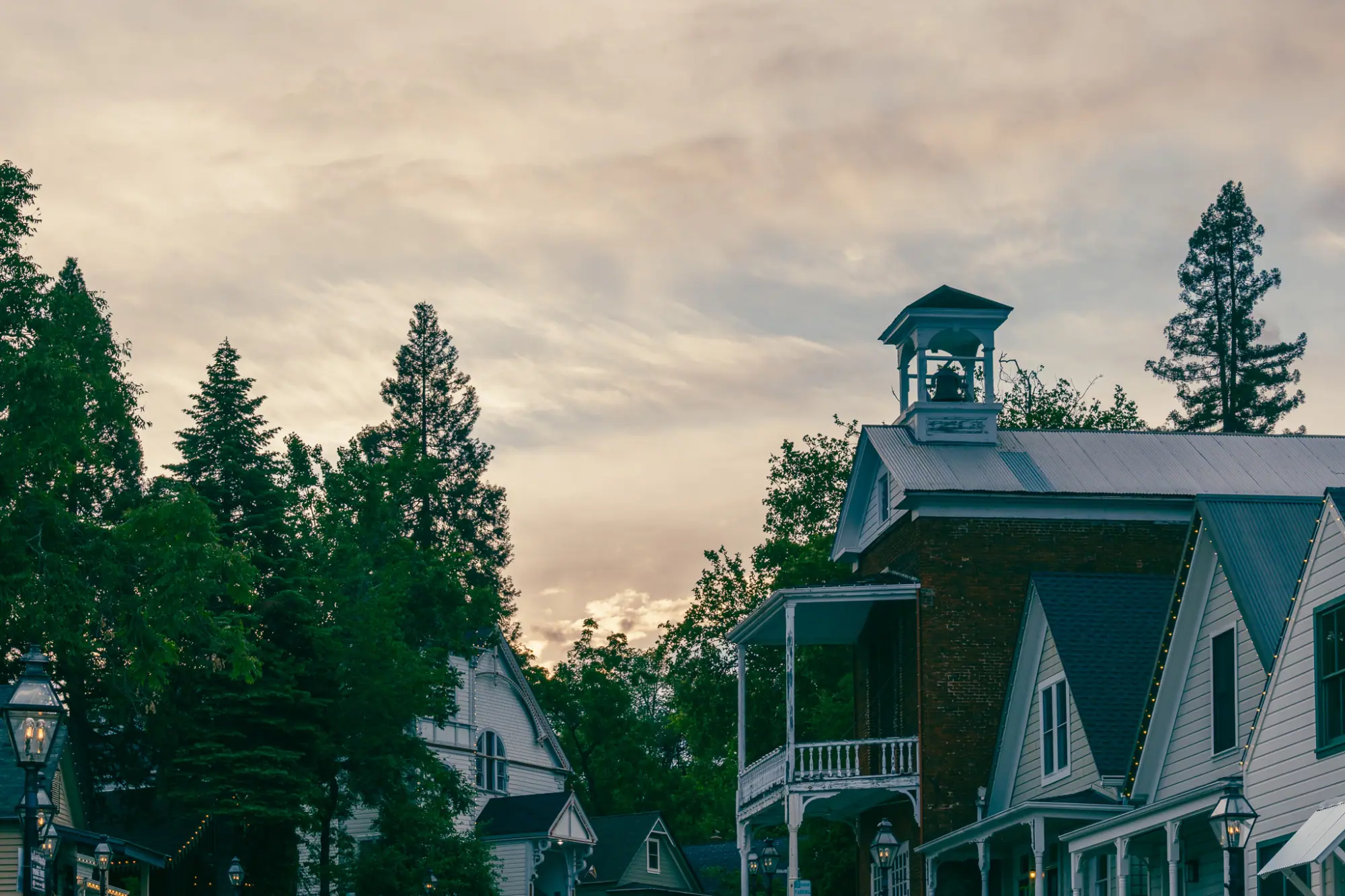 Downtown rooftops and a cupola at dusk