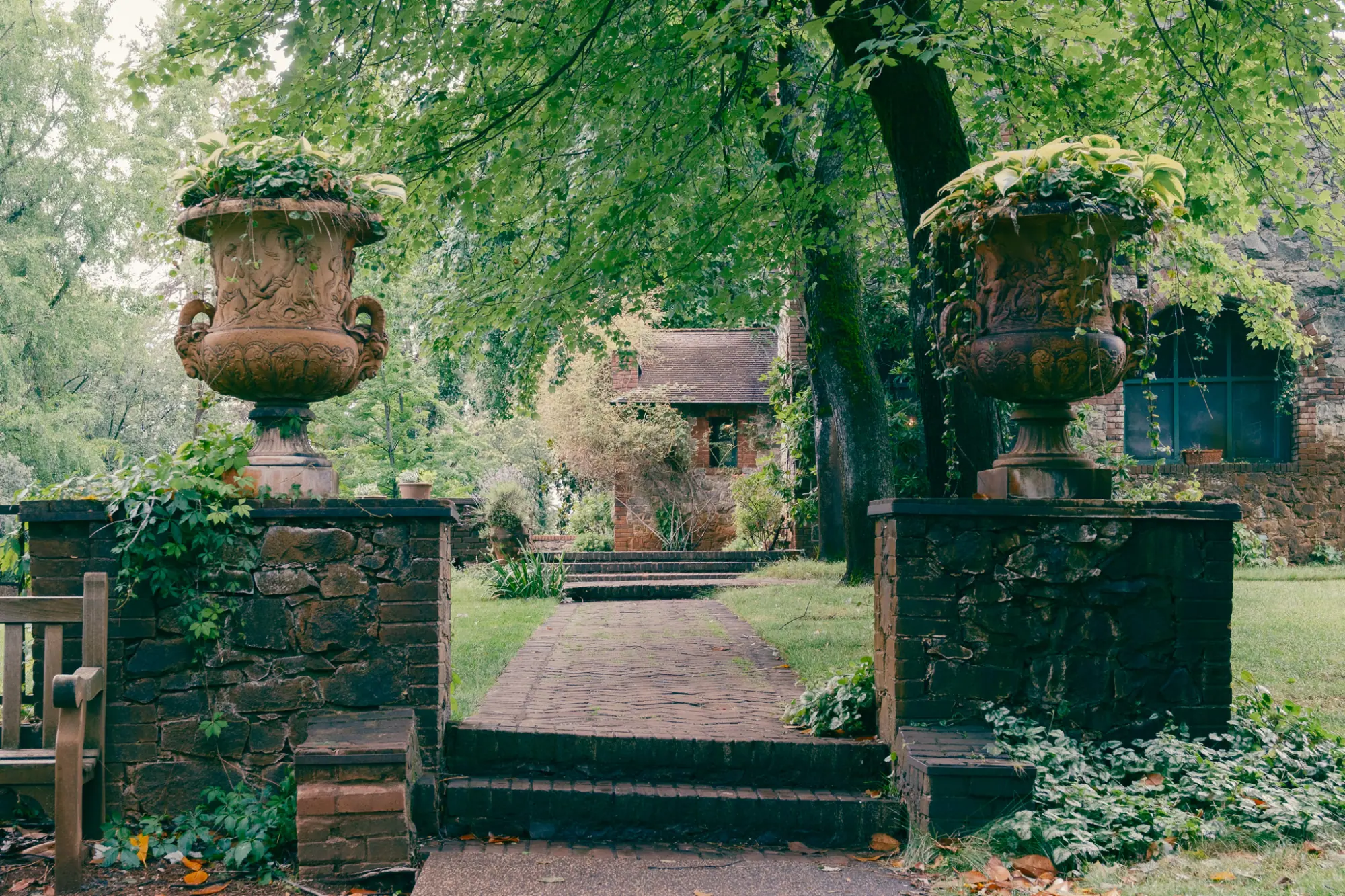 Stone urns flanking a garden path