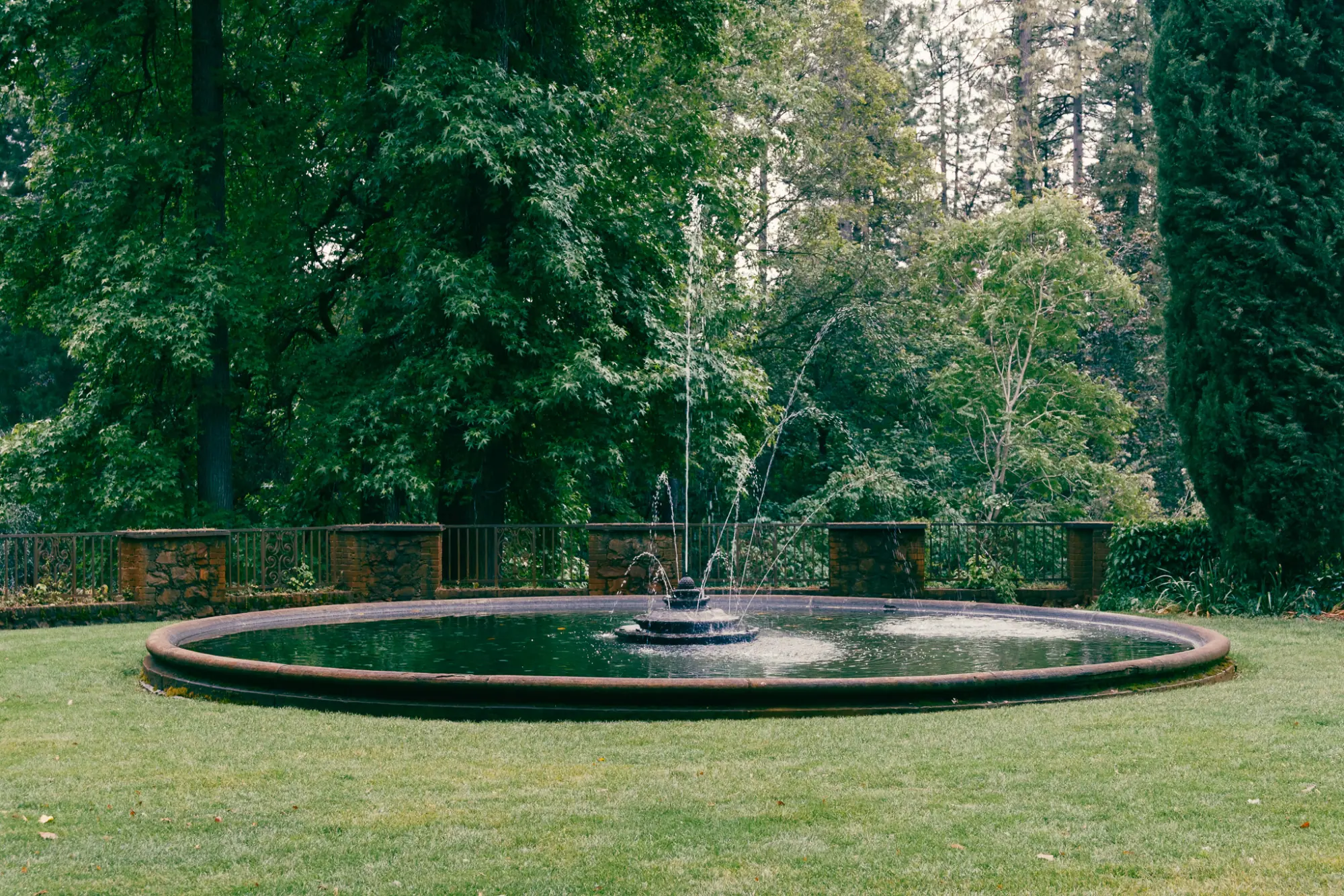 A round fountain pool on the lawn