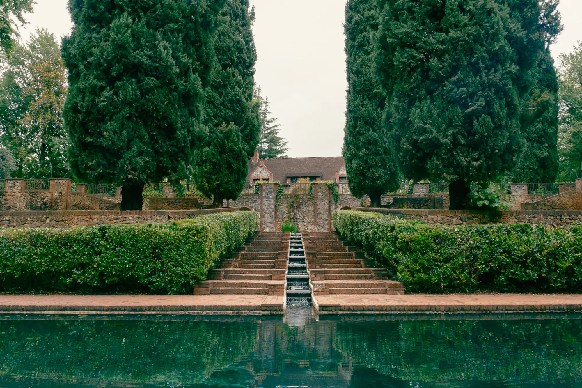 The reflecting pool and cascade between cypress trees