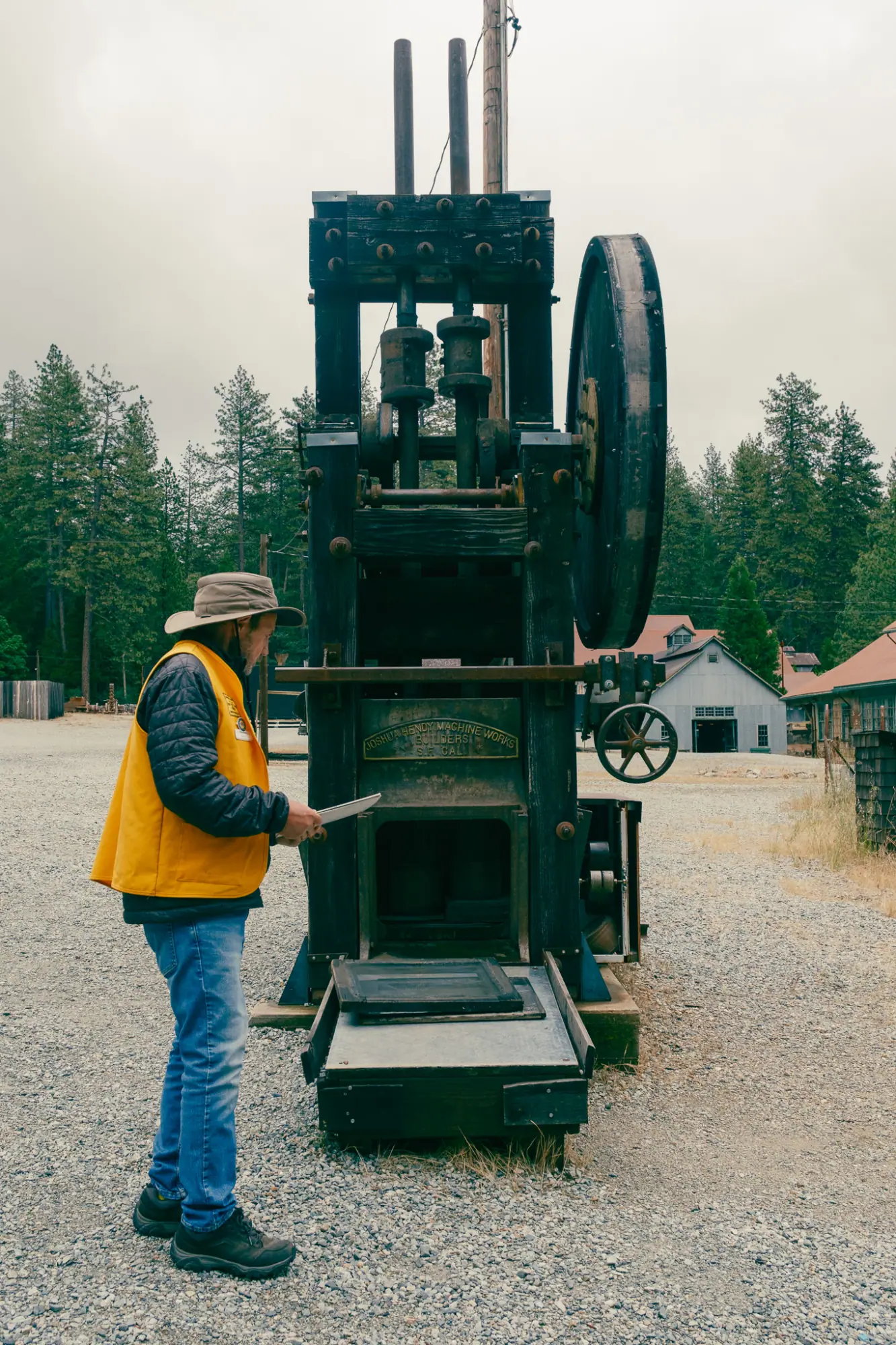 Our tour guide beside a stamp mill