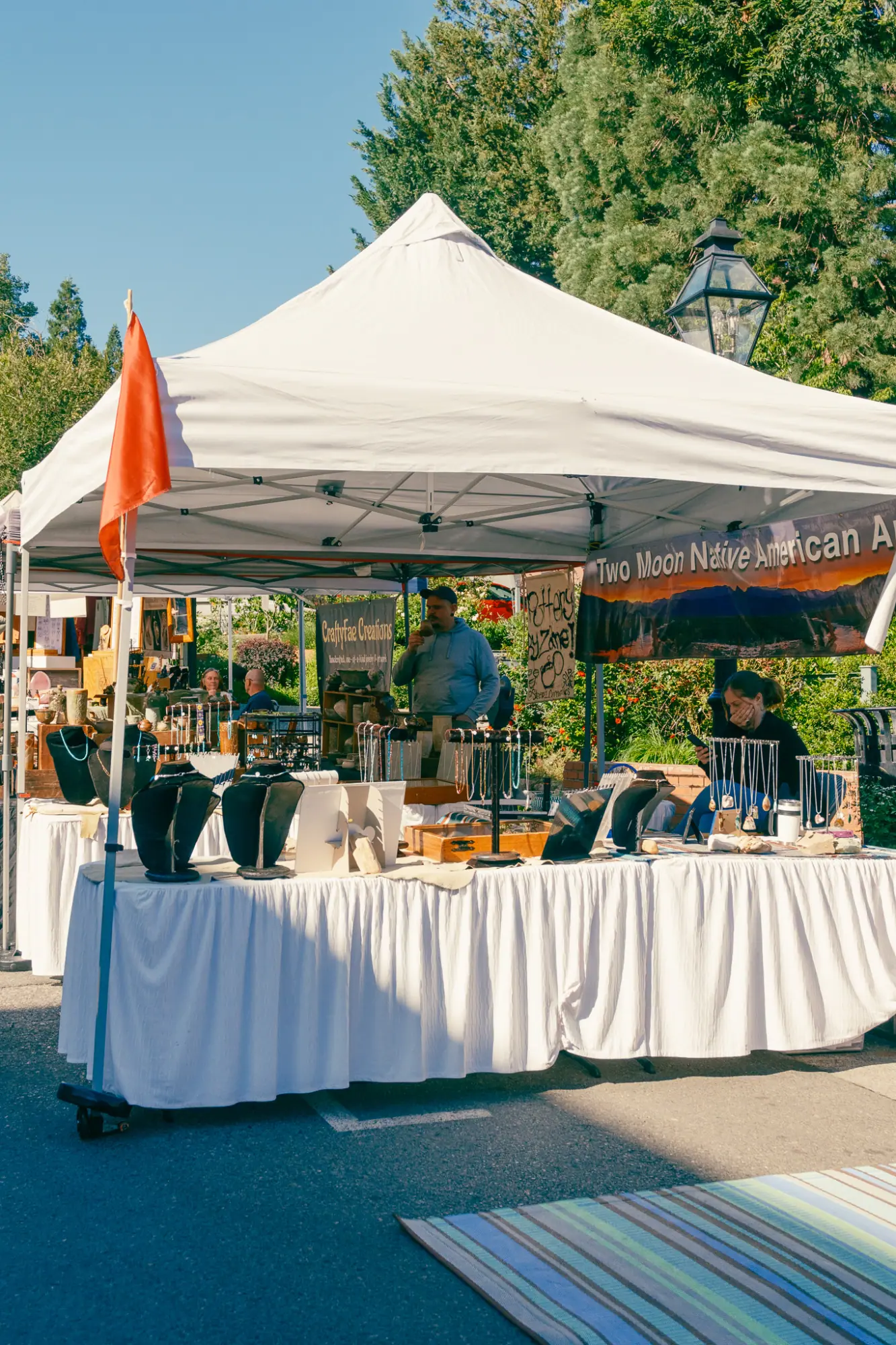 A white tent of market goods