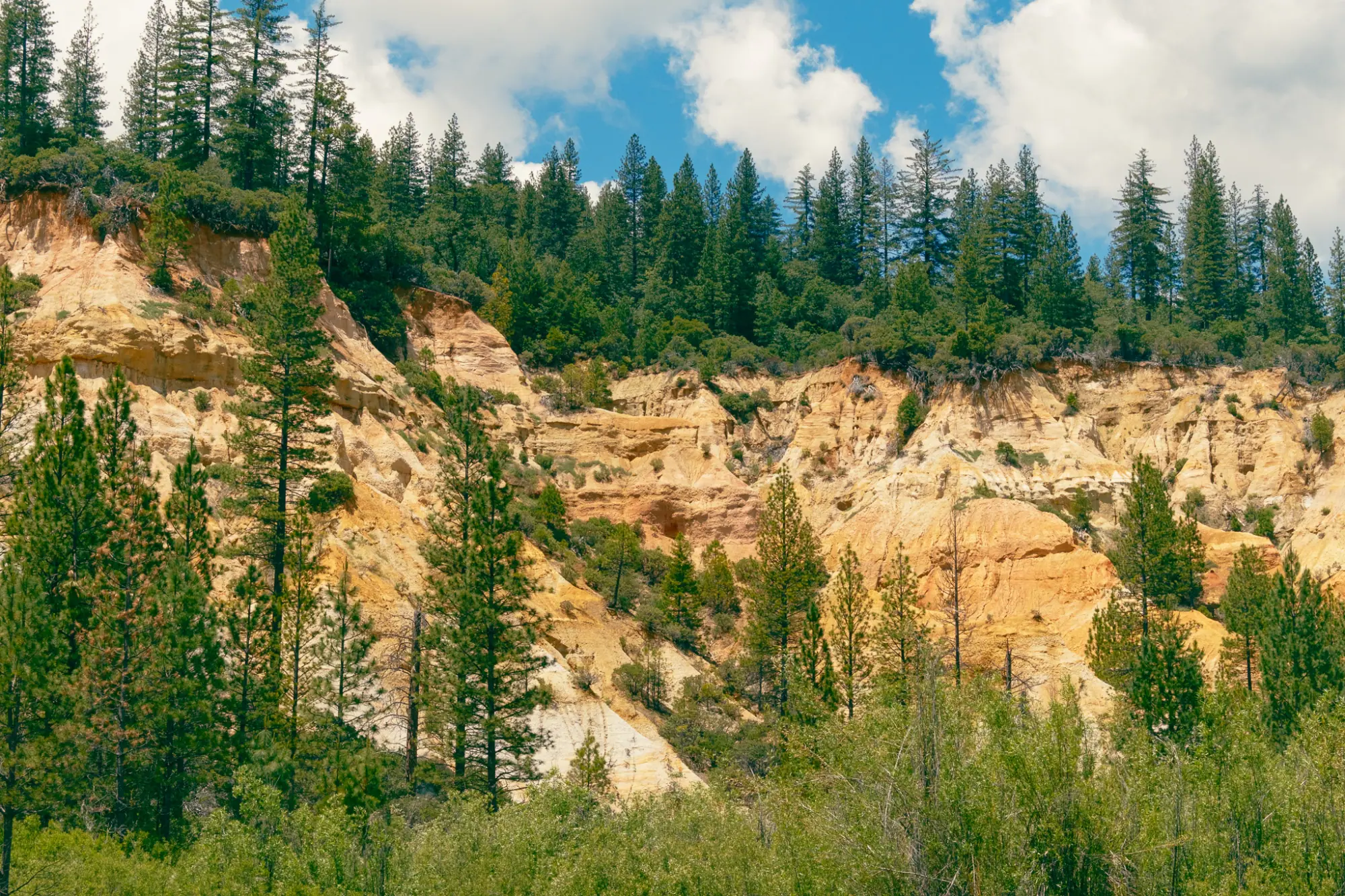 Orange cliffs above the pit floor