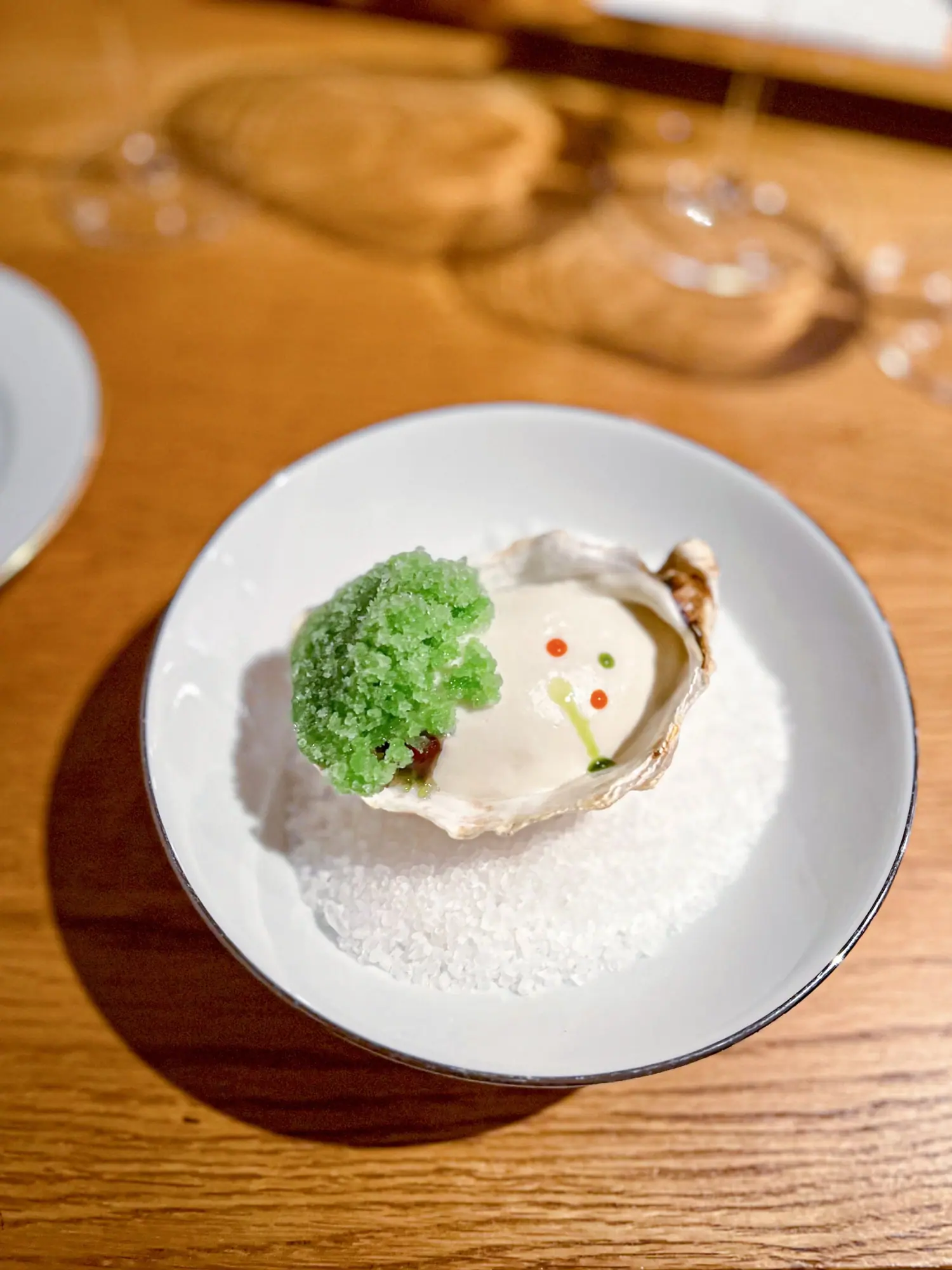 Mont Saint Michel An oyster reimagined — delicate, briny, and clouded in cream with icy green granita and roe pearls that danced like sea foam. A taste of the sea, plated like a sculpture.