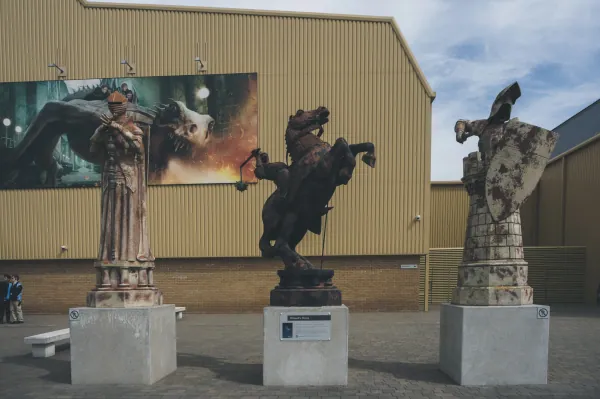 Giant wizard-chess pieces outside the studio