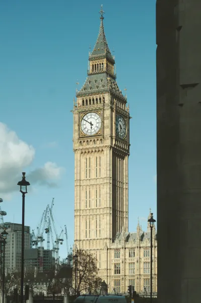 Clock tower framed by a building edge