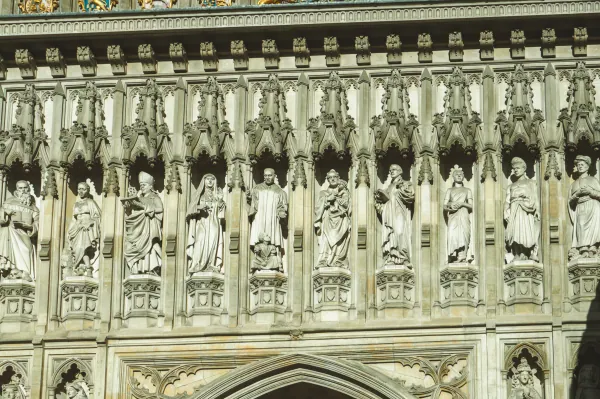 Row of carved 20th-century martyr statues