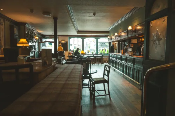 Pub interior with tartan bench and bar