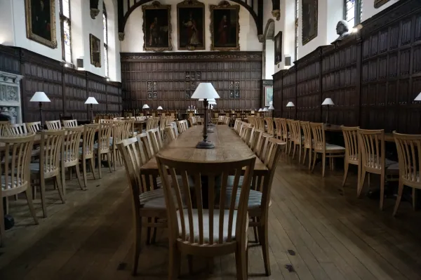 Panelled dining hall with long tables