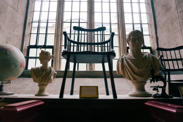 Busts and chair in a window display