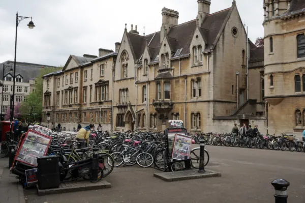 Rows of bikes in front of college buildings