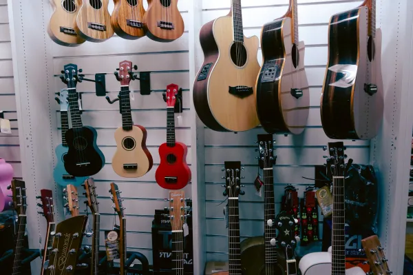 Wall of guitars and ukuleles