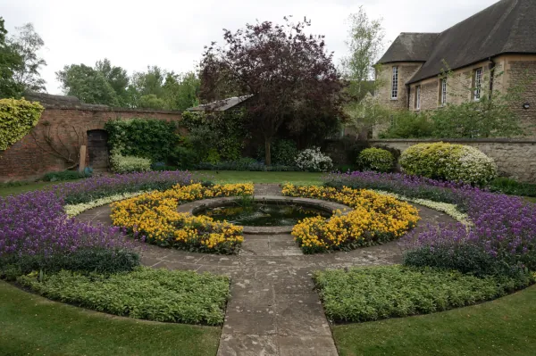 Circular flower bed in purple and yellow