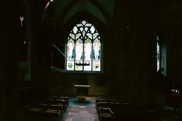 Dark chapel with Burne-Jones-style window