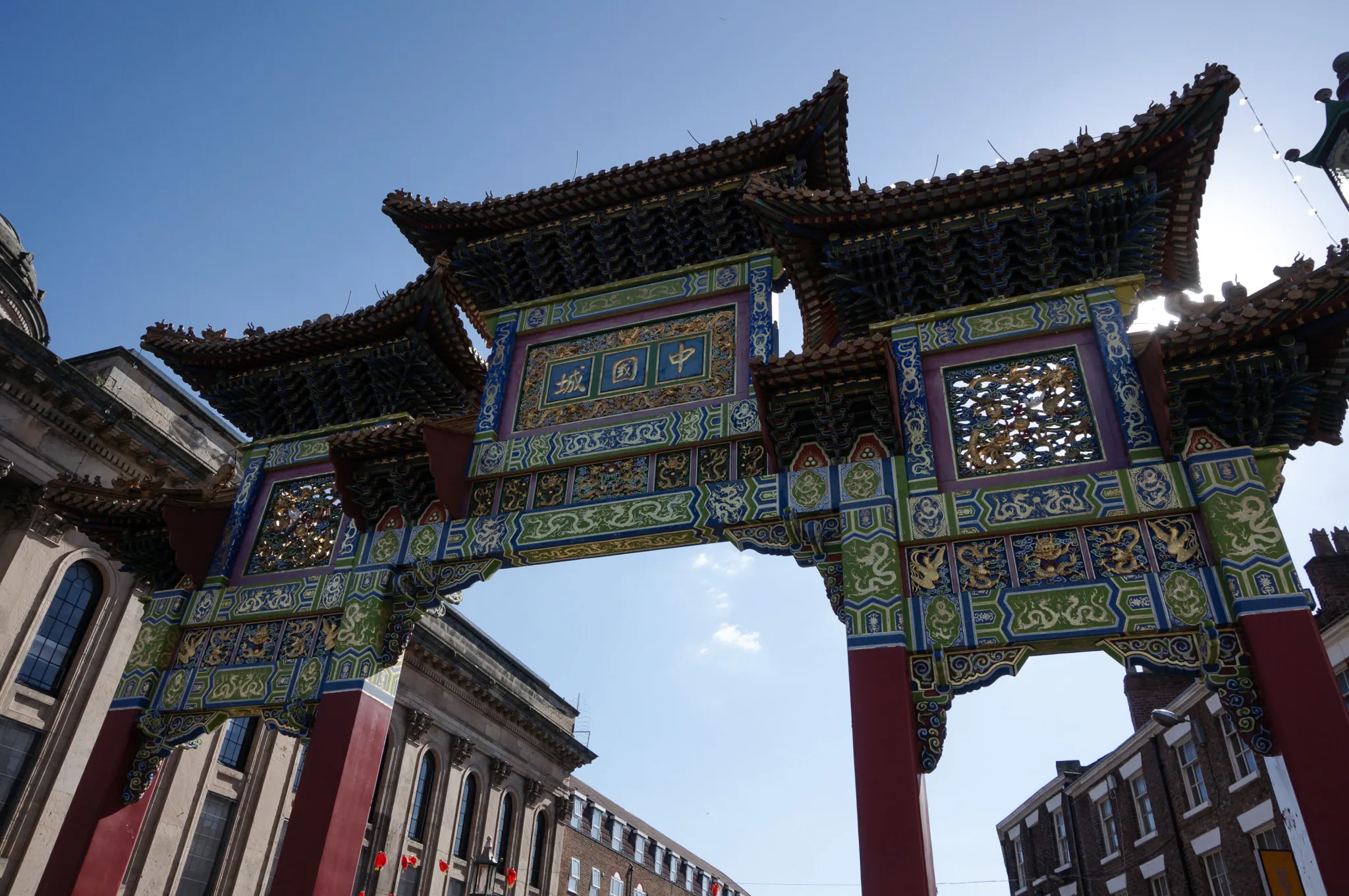 Ornate Chinese arch against blue sky
