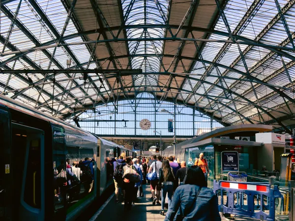 Passengers leaving a train under the shed