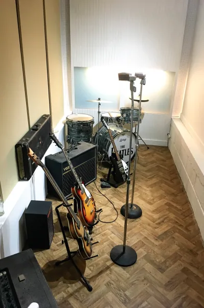 Recording-studio replica with guitars and drums