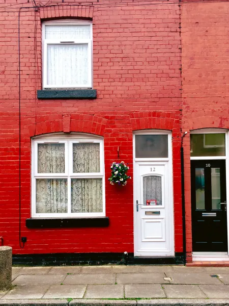 Red-painted terraced house front