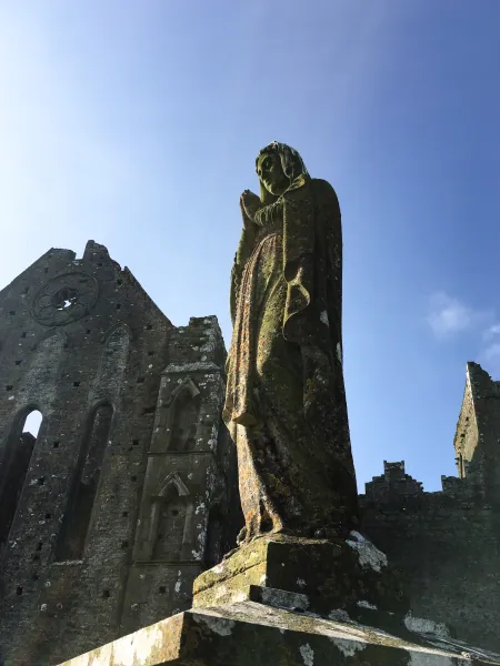 Madonna statue against ruins