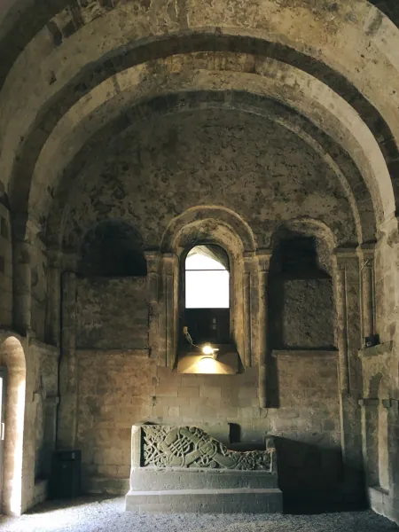 Romanesque interior with sarcophagus