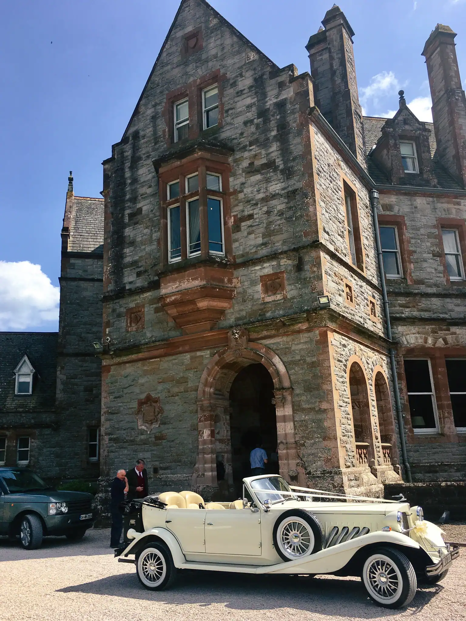 Castle entrance with vintage car