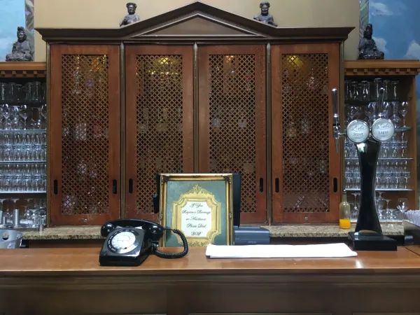 Bar cabinet with vintage telephone