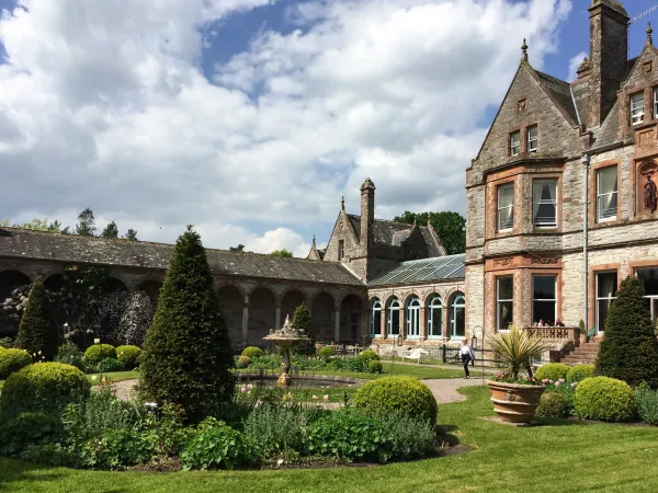 Topiary garden before Victorian buildings
