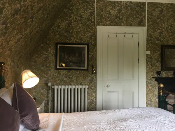 Bedroom corner with lamp and door